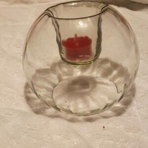 Clear glass with drop down candle. Fits 2 1/2" votive or just a tea light.